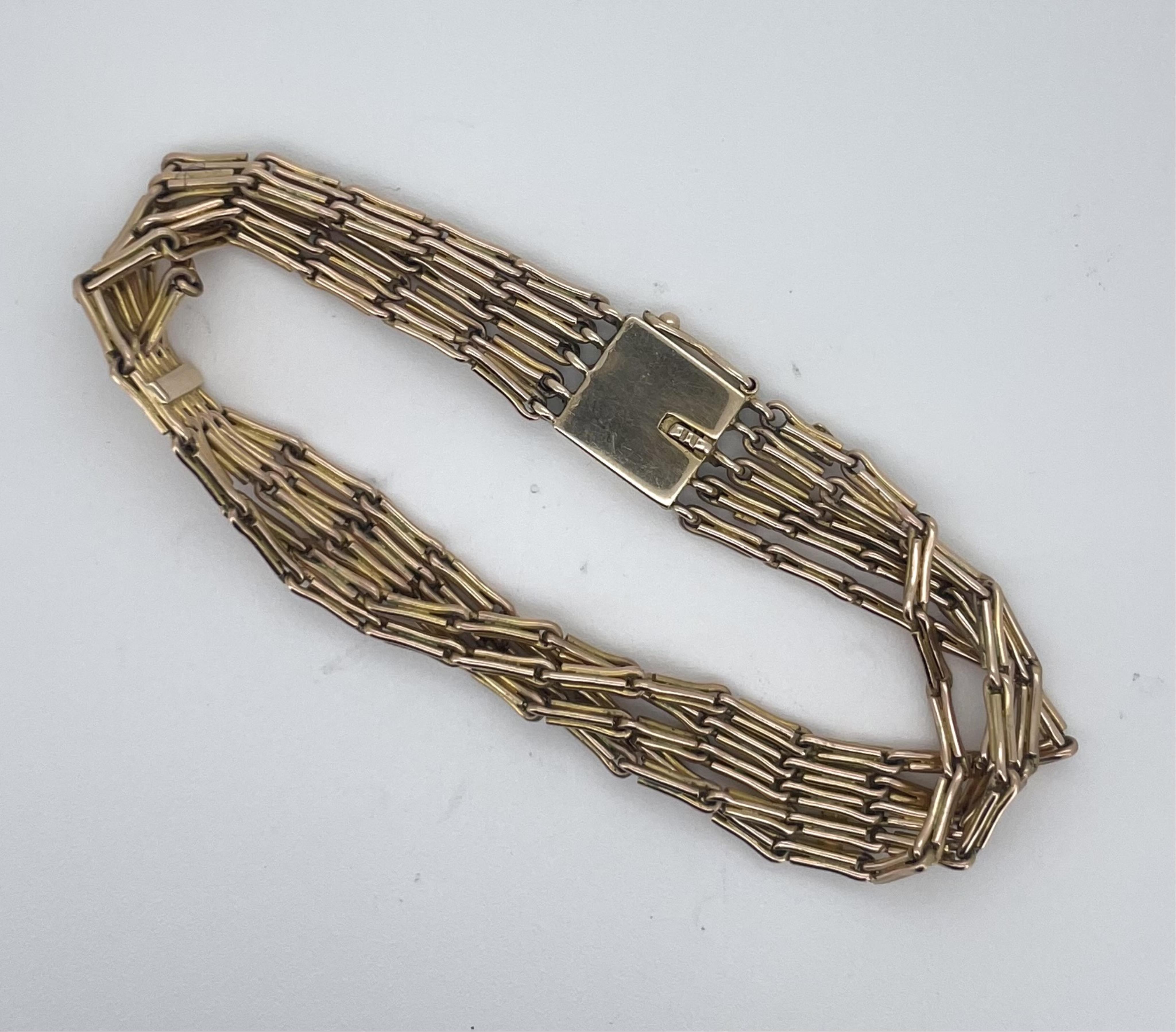 An attractive gold bracelet, early 20th century, composed of five strands of fancy linking, to a panel clasp, length approximately 17cm, gross weight approximately 18 grams